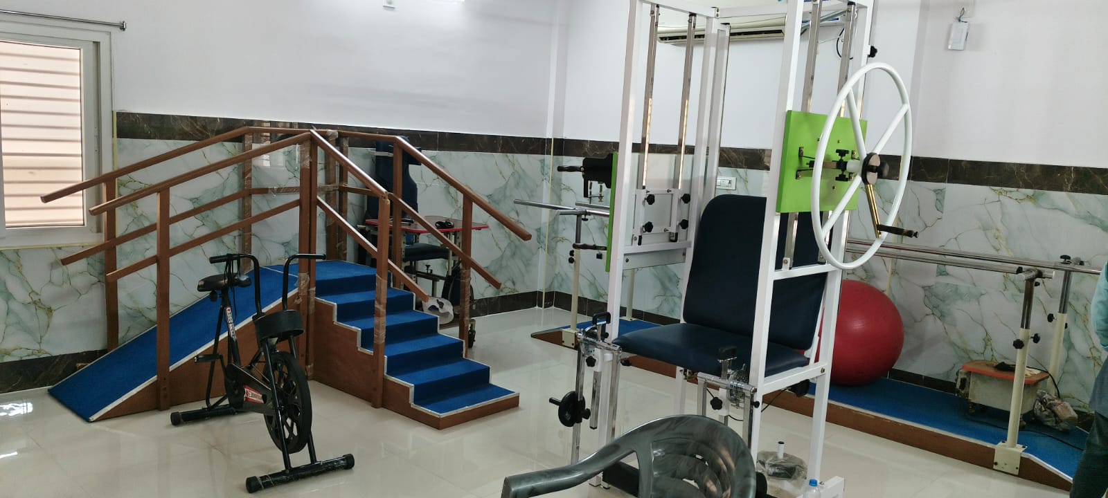 Rehabilitation gym and stair training area at Dr. Naidu Hospital